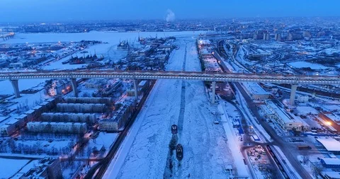 Cebreakers are stabbing ice in the zone of the cargo port in the evening. 動画素材 86825752
