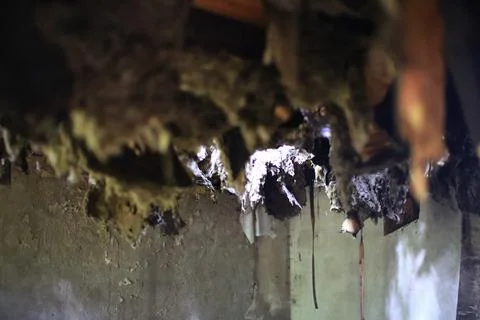 Ceiling in an abandoned building falling down creating a hole Stock Photos