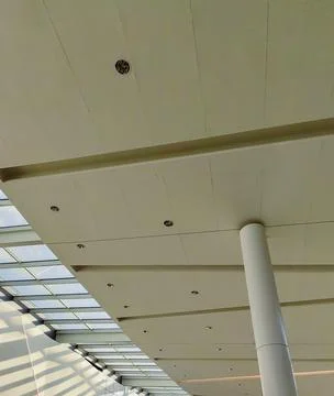Ceiling with artificial lights and large windows Stock Photos