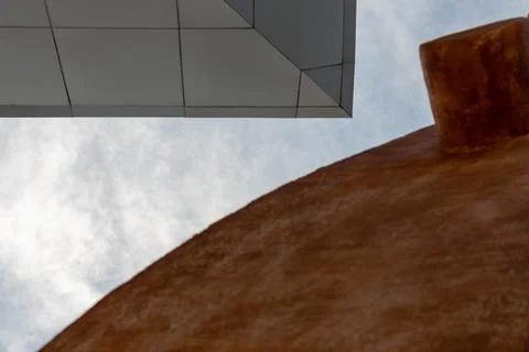 Ceiling from below gray and brown geometric figures view to the sky Stock Photos