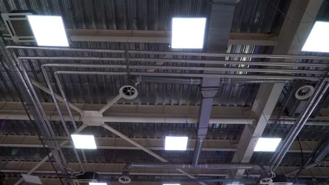 Ceiling of big industrial building with air duct ventilation pipes Stock Footage 112986853
