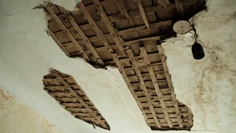 Ceiling of building collapsed exposing wooden crate. War, destruction, disaster. Video stock 247177453