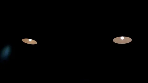 Ceiling with built in halogen lamps, switching on slowly in darkness. Stock Footage 103926337
