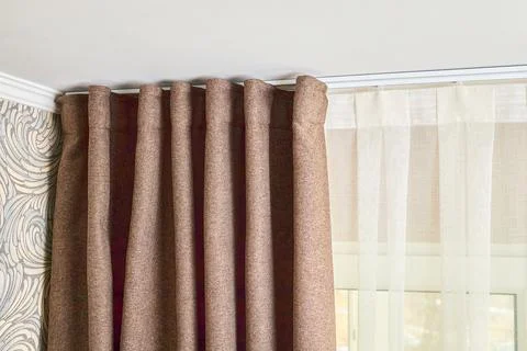 Ceiling cornice with drapes white curtain or tulle. Interior details close up Stock Photos