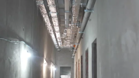 Ceiling of corridor covered with ventilation pipes Stock Footage 316099285