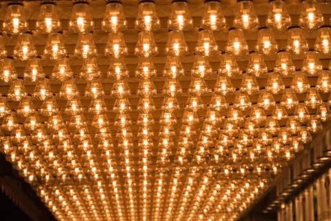 Ceiling covered in filament light bulbs Stock Photos