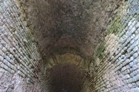 Ceiling of dark medieval tunnel 库存照片