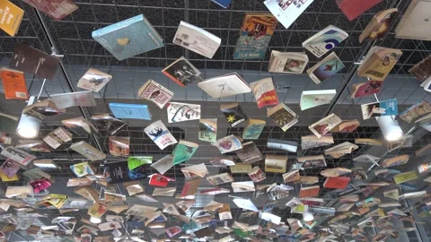 Ceiling decoration made of books on net in the Istanbul Museum of Modern Art Stock Footage 289099667