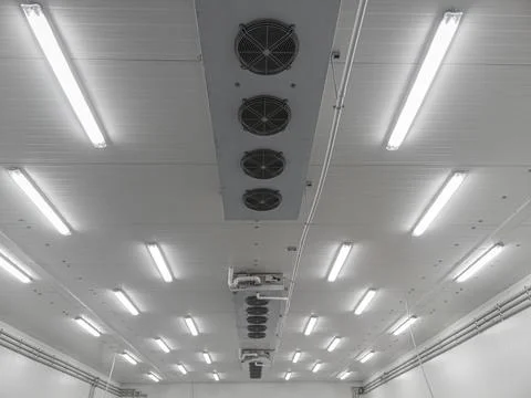 Ceiling of factory interrior with boxes of an industrial refrigerator. Stock Photos