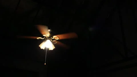 Ceiling Fan and Lights Break the Darkness Stock Footage 10573595