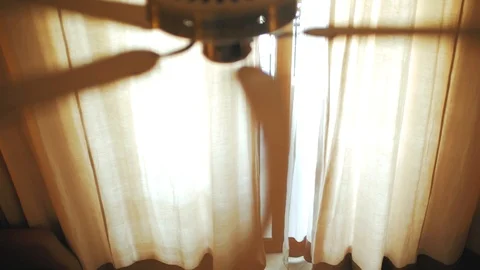 Ceiling fan on the background of the curtain. view from above Stock Footage 101005376