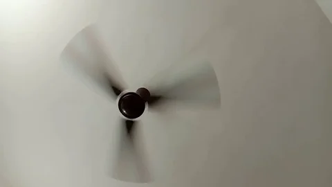 A ceiling fan is constantly rotating Stock Footage 126766815