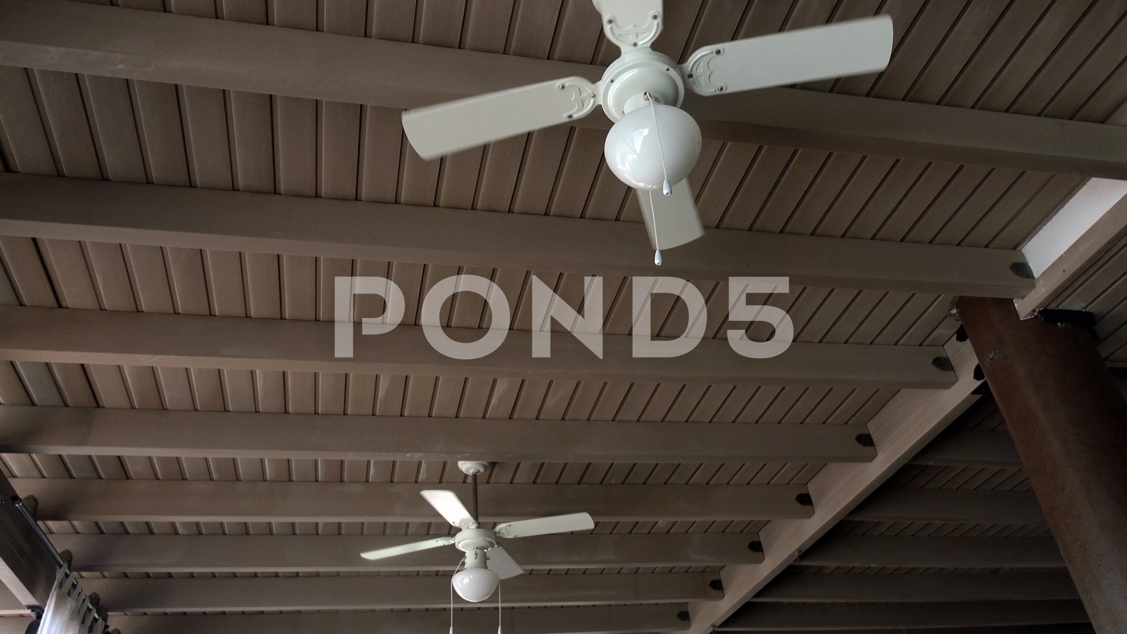 Ceiling fan rotating in an cafe with 