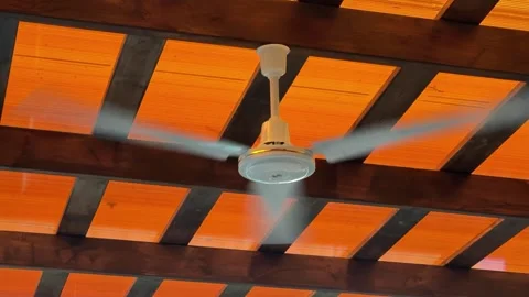 Ceiling Fan Rotating in Slow Motion During Summer Heat Stock Footage 341682083