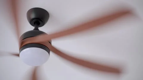 Ceiling fan rotating on white ceiling inside modern home Stock Footage 340236578