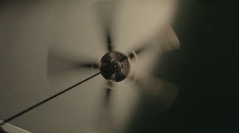 Ceiling fan spinning on high Stock Footage 24328843