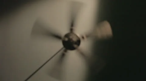 Ceiling fan spinning on high, out of focus Stock Footage 24327310