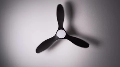Ceiling fan spinning overhead in slow motion Stock Footage 344692170