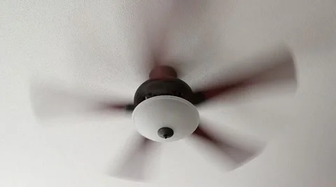 A Ceiling Fan Spins on High Setting Stock Footage 10953806