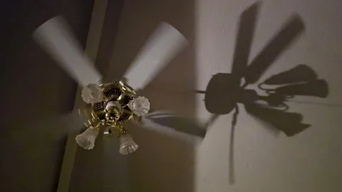 Ceiling fan turning with shadow | Stock Video | Pond5