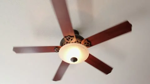 A Ceiling Fan Turns Slowly with Light Stock Footage 11081581