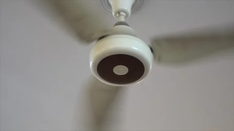 A ceiling fans with three wings running in slow motion Stock Footage 272753221
