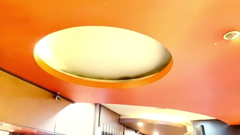 The ceiling of the house with bright orange color and circular lighting Video stock 333634716