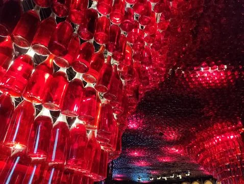 Ceiling Installation of Hanging Red Wine Bottles 스톡 사진