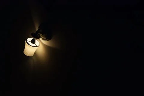 Ceiling lamp on a black background wall Stock Photos