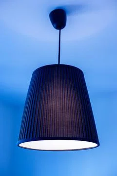 Ceiling lamp in blue light. Ceiling lamp. Stock Photos