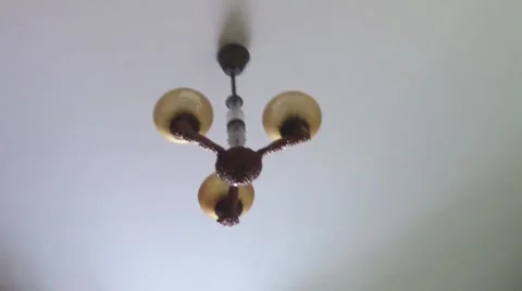 Ceiling lamp dangling from earthquake Stock Footage