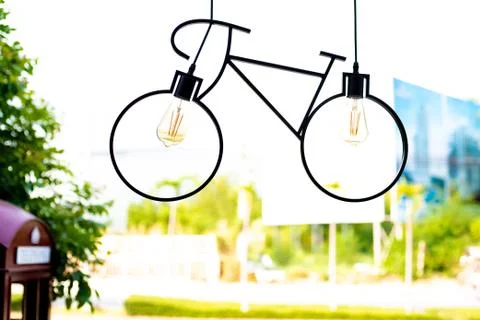Ceiling lamp. Light fixture made in the shape of a bicycle. Stock Photos