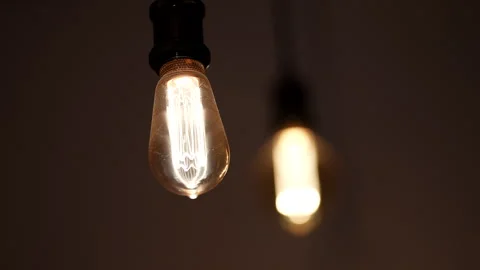 Ceiling Light Bulbs Switching On and Off in a Dark Interior Stock Footage 346837140