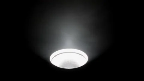 Ceiling light fixture illuminating in a dark room, Close-up of a ceiling light Stock Footage 300886390