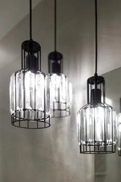Ceiling light. Modern three-lamp chandelier. Lamp in the bathroom. Reflected  Stock Photos