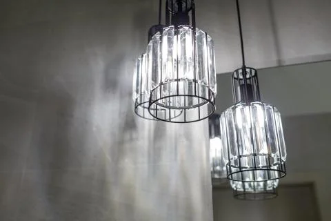 Ceiling light. Modern three-lamp chandelier. Lamp in the bathroom. Reflected  Stock Photos