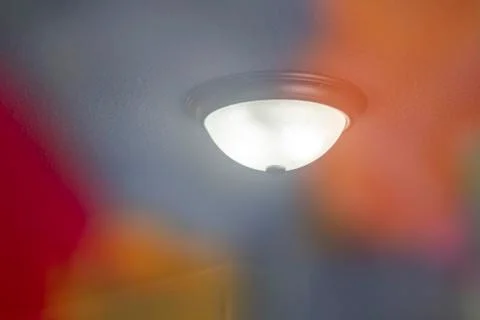 Ceiling Light In Reflection Of Framed Painting 写真素材
