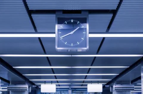 Ceiling in a long corridor lit by lights Stock Photos