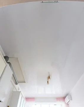 Ceiling made of white plastic panels in the interior of the kitchen Stock Photos