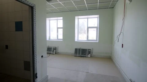 Ceiling metal grids and bare walls indicate room renovation Vídeos de archivo 332718051