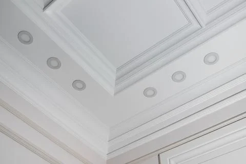 Ceiling moldings in the interior, detail of a angular ceiling skirting and lamps Stock Photos