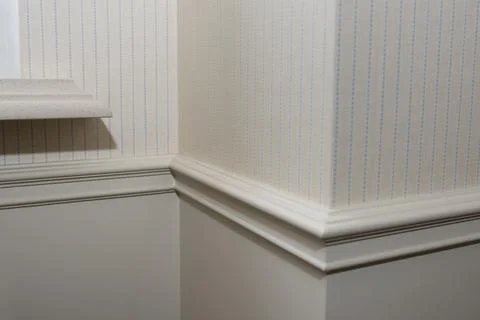 Ceiling moldings in the interior, detail of a angular wall skirting 스톡 사진