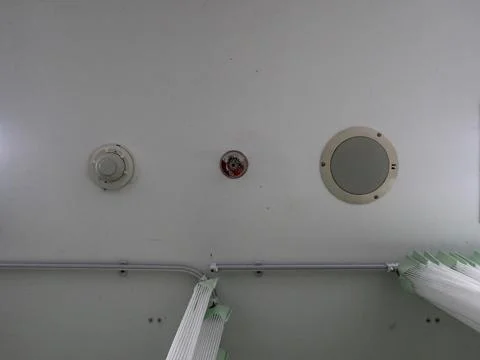 Ceiling mounted fire warning devices and speakers Fotos de archivo