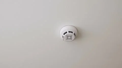 Ceiling-Mounted Smoke Detector for Fire Safety Compliance 스톡 동영상 312474268
