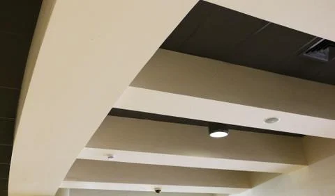 Ceiling over reception hall and corridor in business center. Stock Photos
