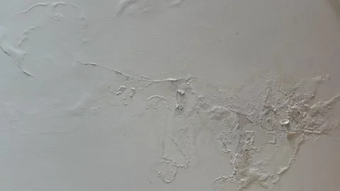 Ceiling with peeling paint and plaster from water leak and moisture damage.  Stock Footage 340645708
