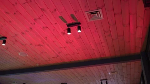 Ceiling in a restaurant with different colors from light music Vídeo Stock 305315930