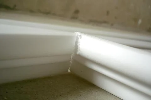 Ceiling Skirting Installation in a Cozy Interior Corner Stock Photos
