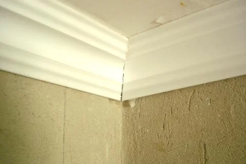 Ceiling Skirting Installation Creating a Seamless Corner Finish Stock Photos