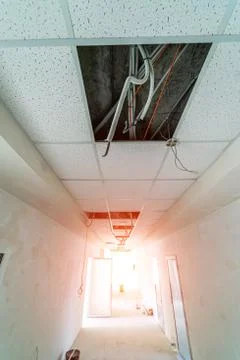 Ceiling structure before installation of gypsum plasterboard. Cables and elec Stock Photos